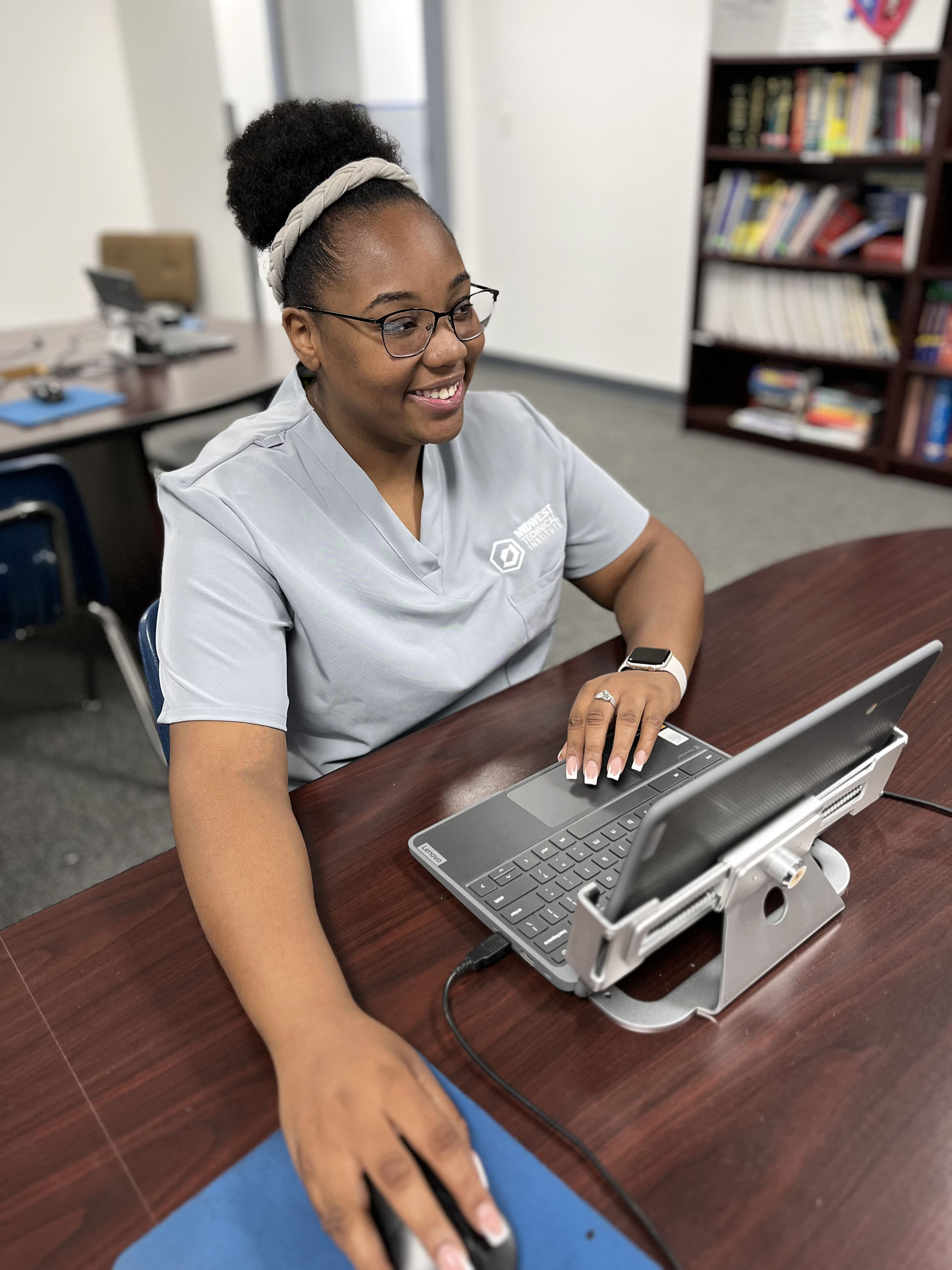 Medical Coding Hybrid Program Student on a Laptop