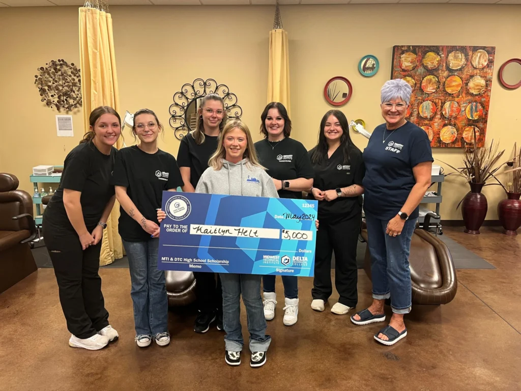 Scholarship Winner holding Check